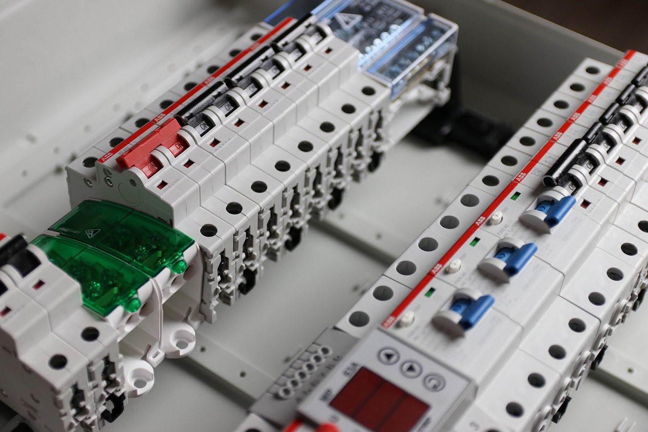 Rewired switchboard filled with rows of modern circuit breakers